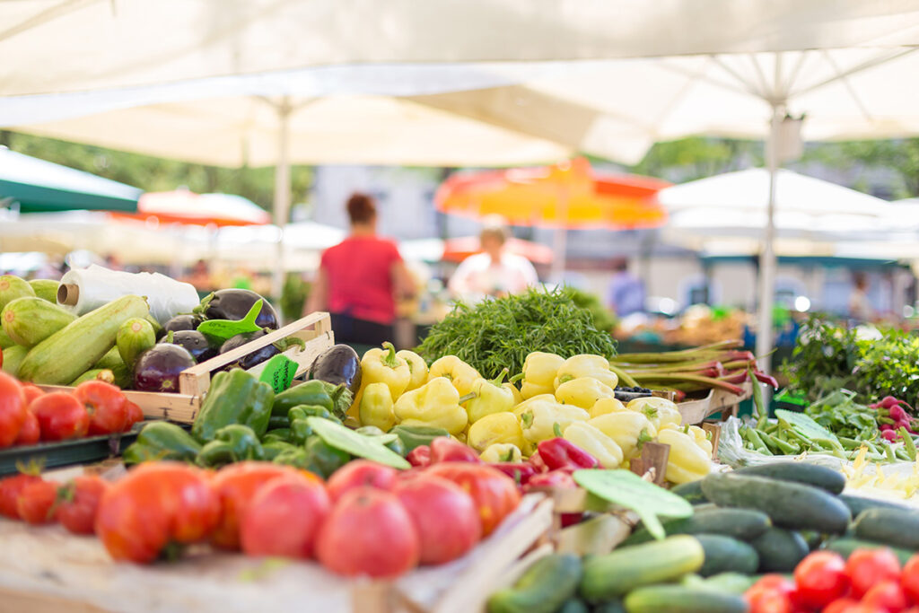 Tomatoes and other vegetables at a grocery store in the enablement phase of their change management project.