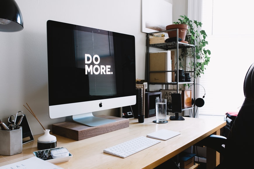 apple monitor displaying words: “do more”