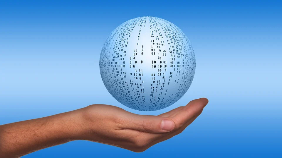 image of a ball covered in binary data floating over open hand