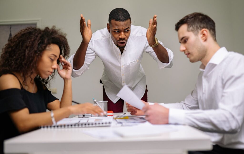 frustrated employees in group meeting